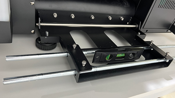 DTF Mini level check on the film roll bracket.