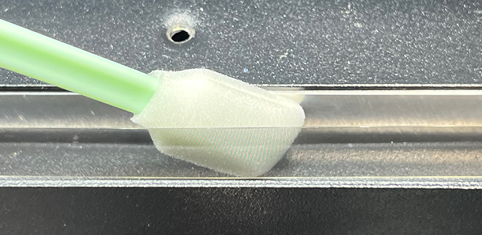 DTF Mini encoder stip cleaning with foam swab, back side of strip